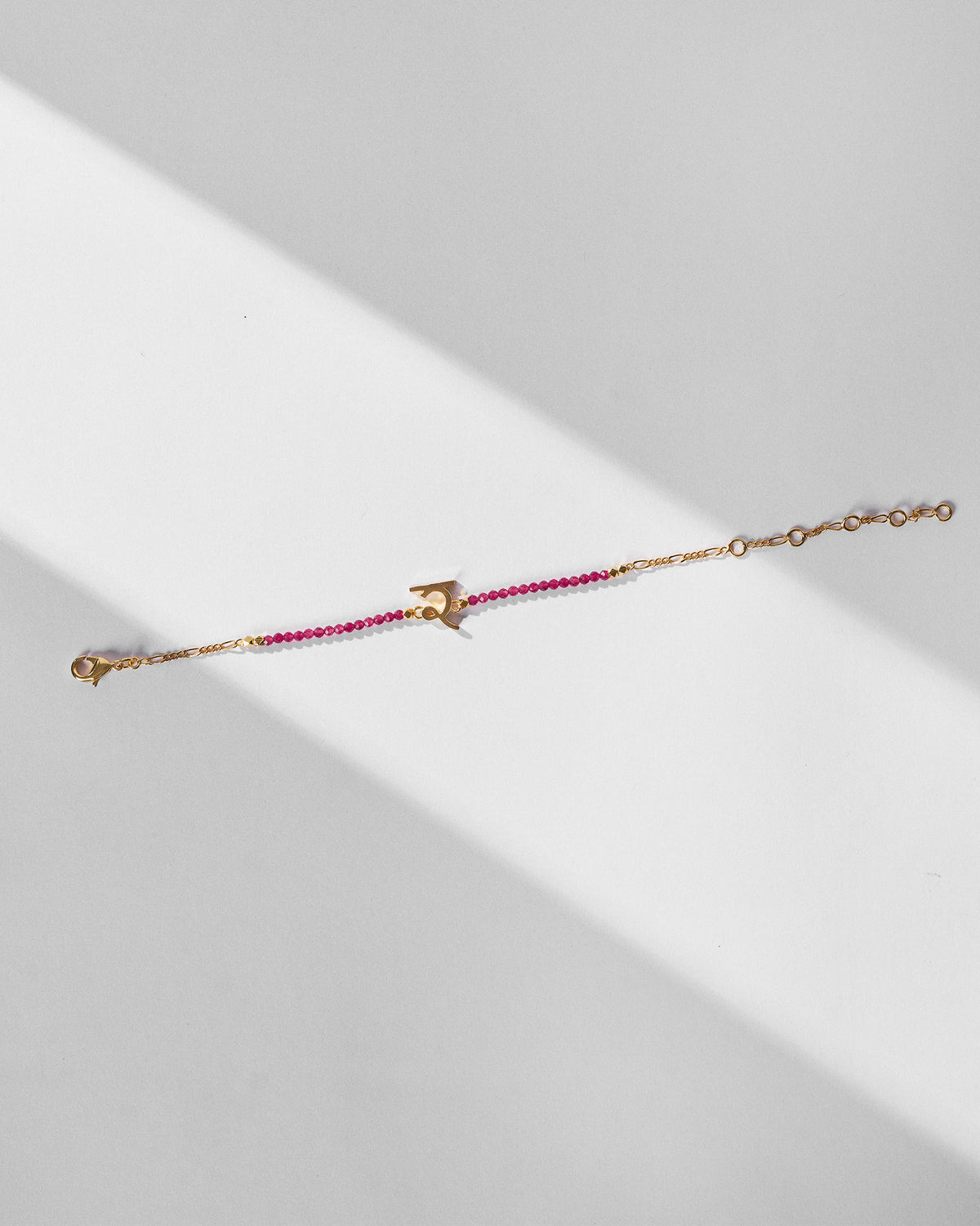 Akshar Bracelet (R) - Gold stretched out, showing its extension chain.
