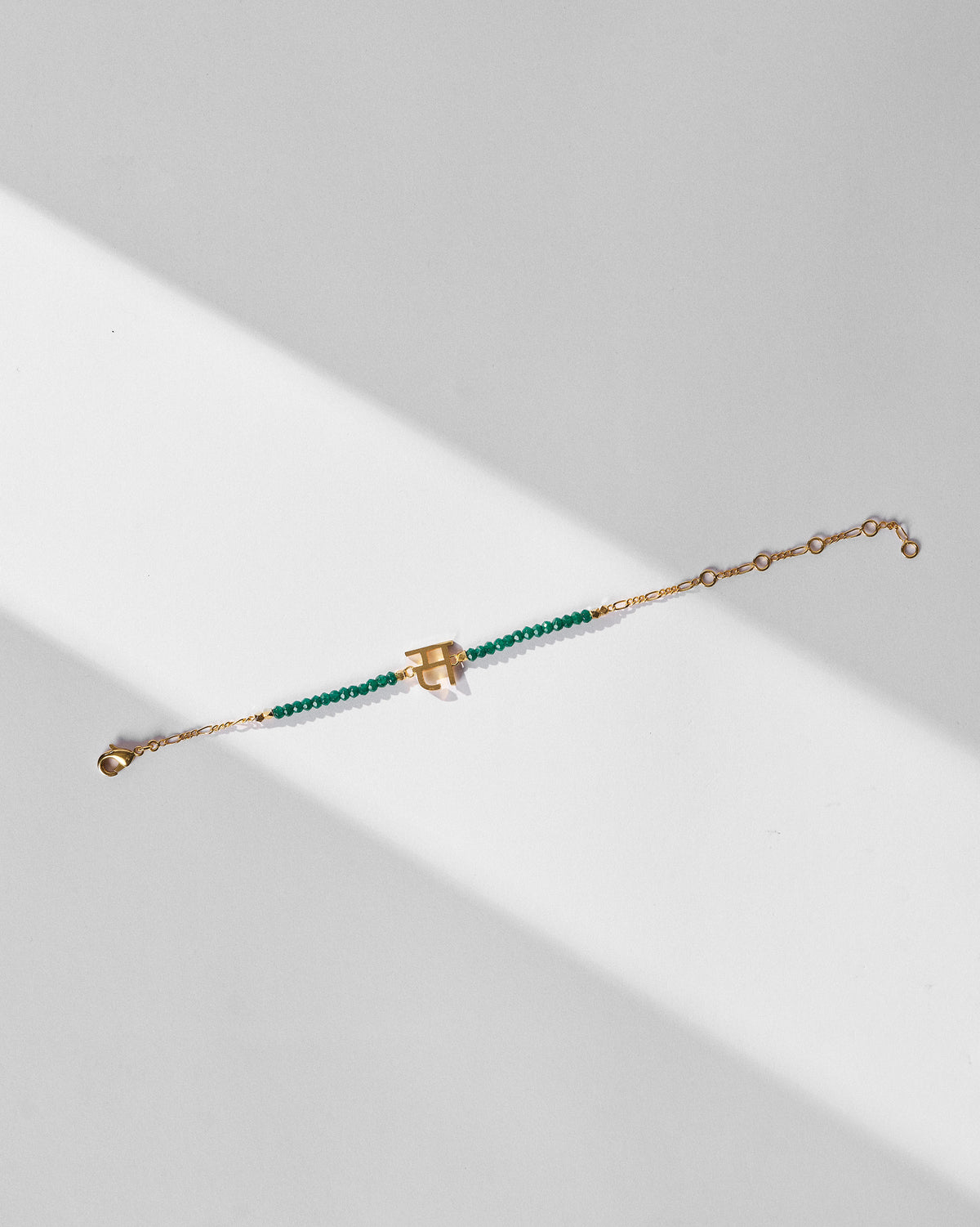 Akshar Bracelet (S) - Gold stretched out, showing its extension chain.