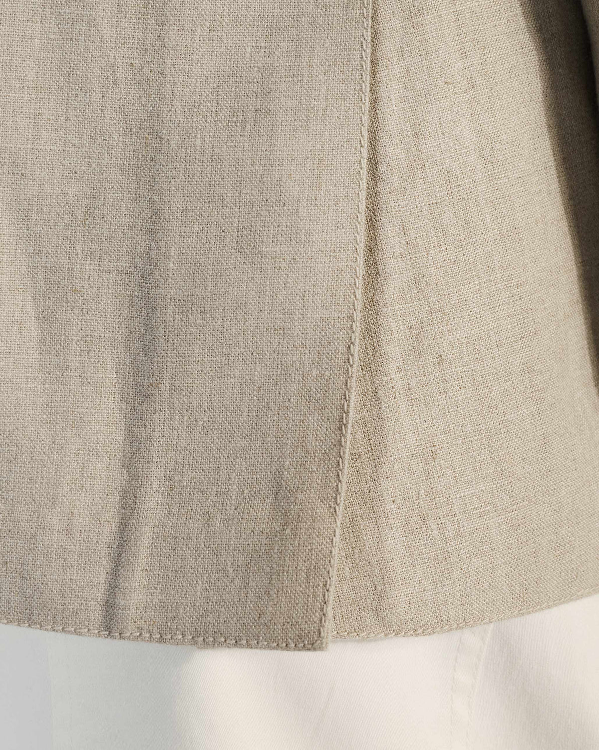 Close-up of the beige linen weave on a Tahr bandhgala.