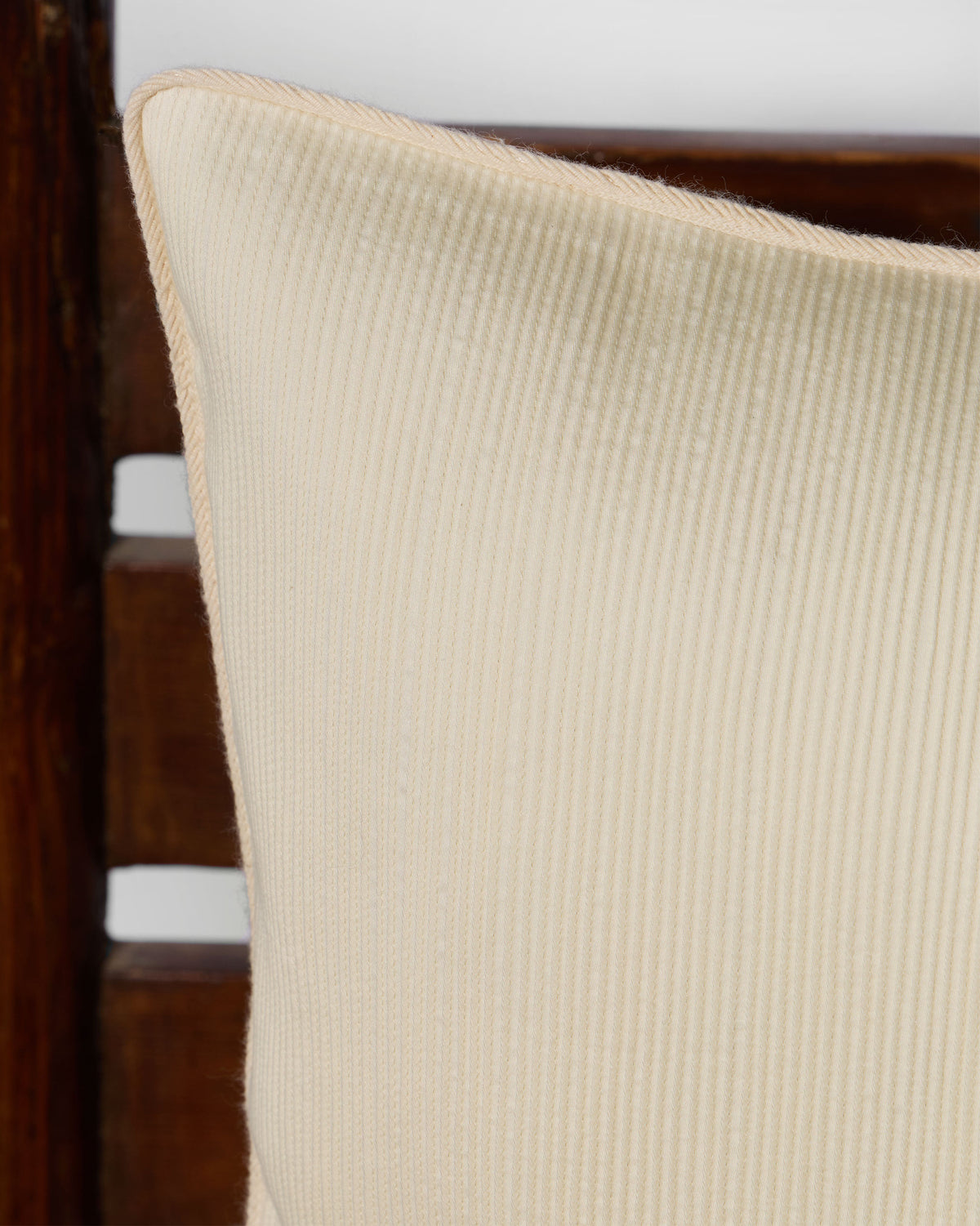 Close-up of the cream pintuck texture on the Nilgiri Champaca cushion front.