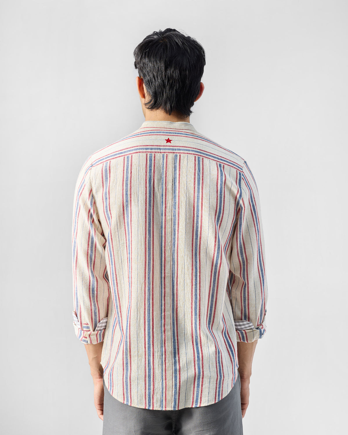Nawab Shirt back with horizontal yoke stripes and red star embroidery.