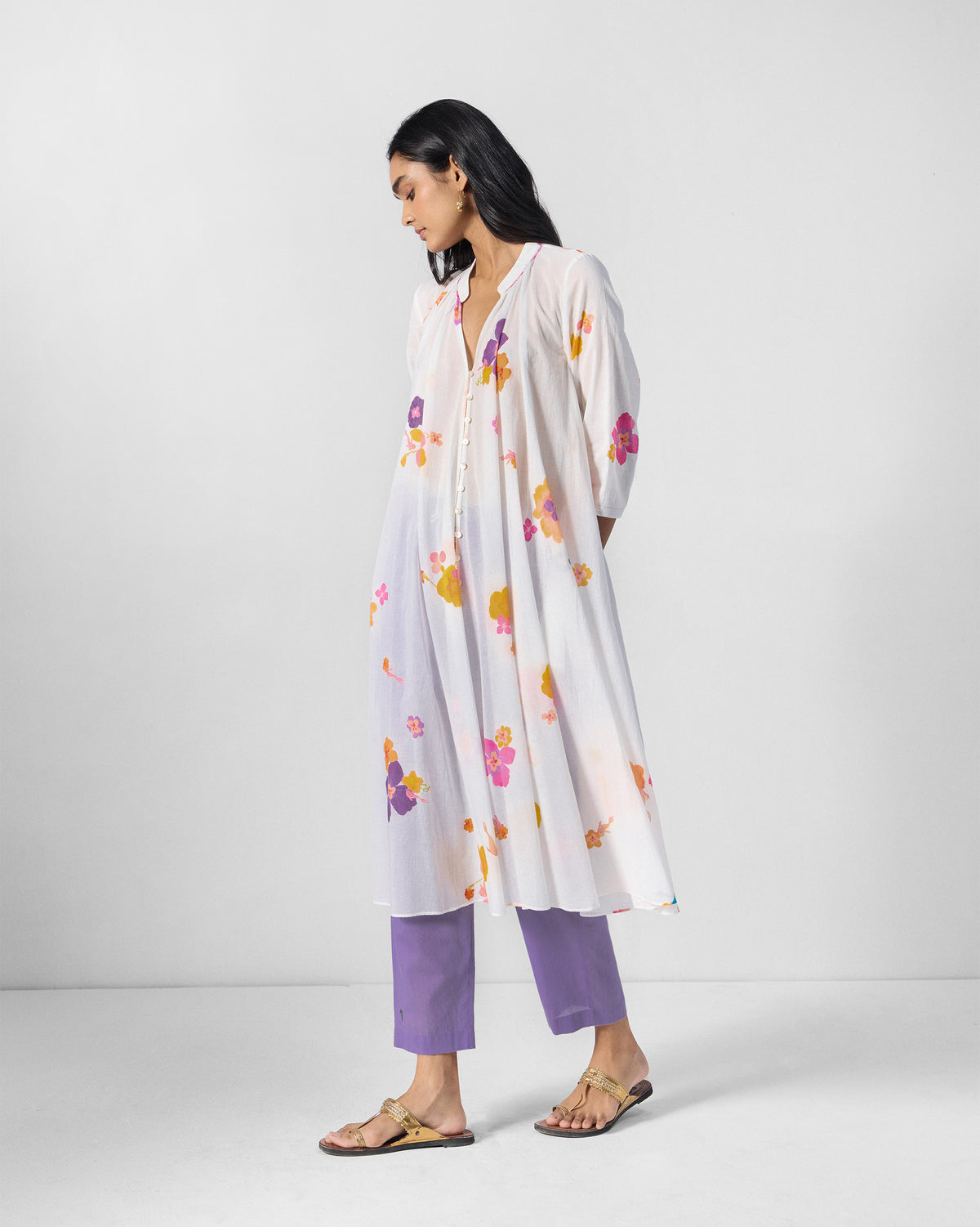 Person wearing an ivory floral Mirage kurta at a three-quarter angle.
