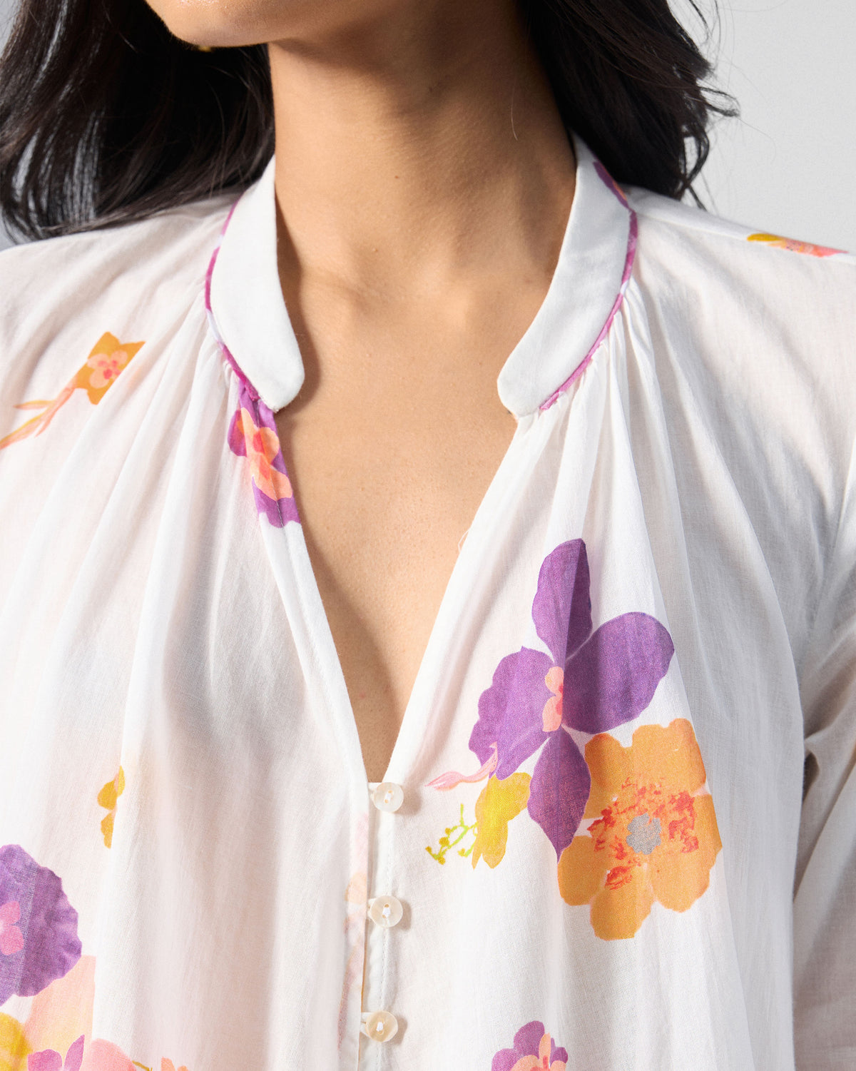 Close-up of an ivory Mirage kurta collar with floral print.