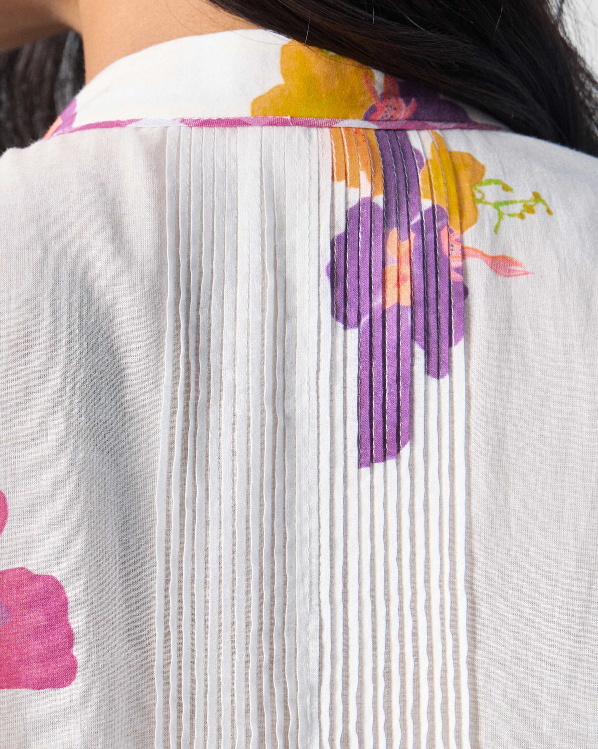 Close-up of pin-tucks on the back of an ivory Mirage kurta.
