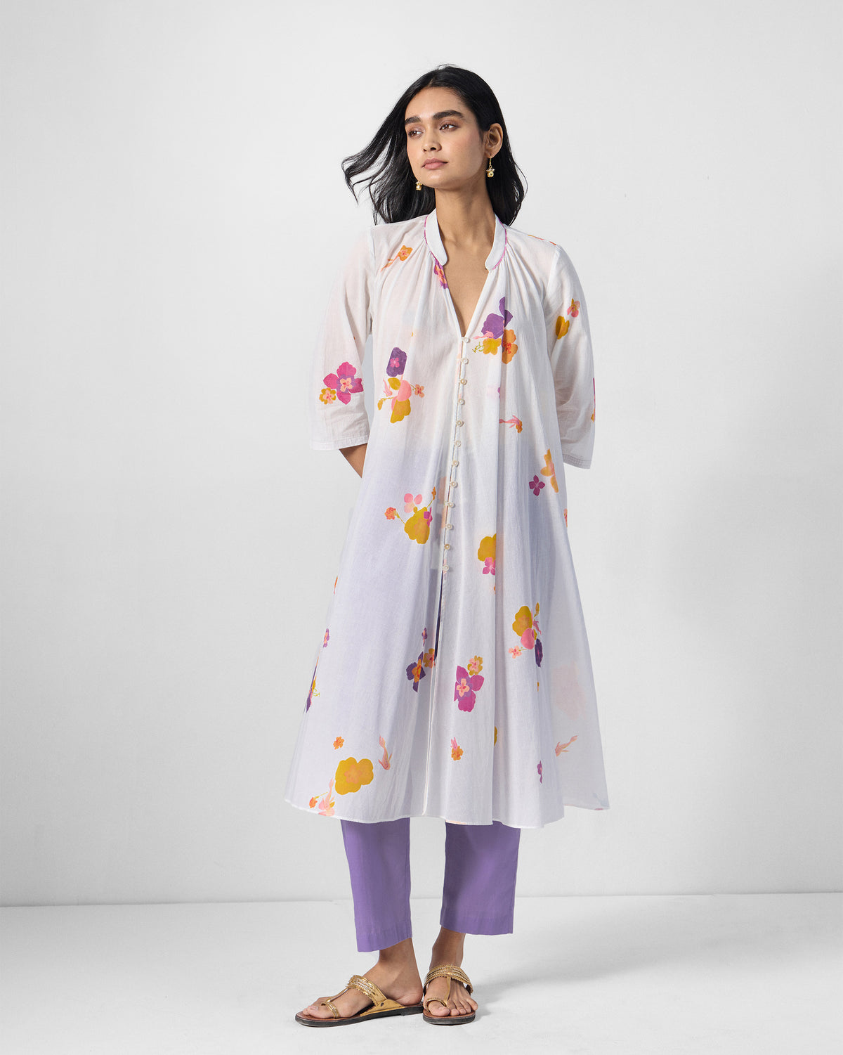 Person wearing an ivory Mirage kurta with a pink floral print.