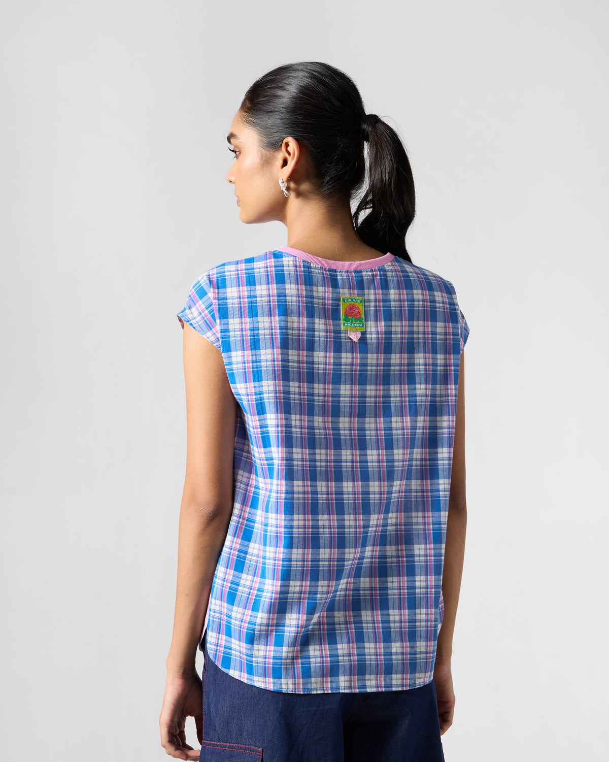 Back of a multicolour Faye top in blue and pink checks.