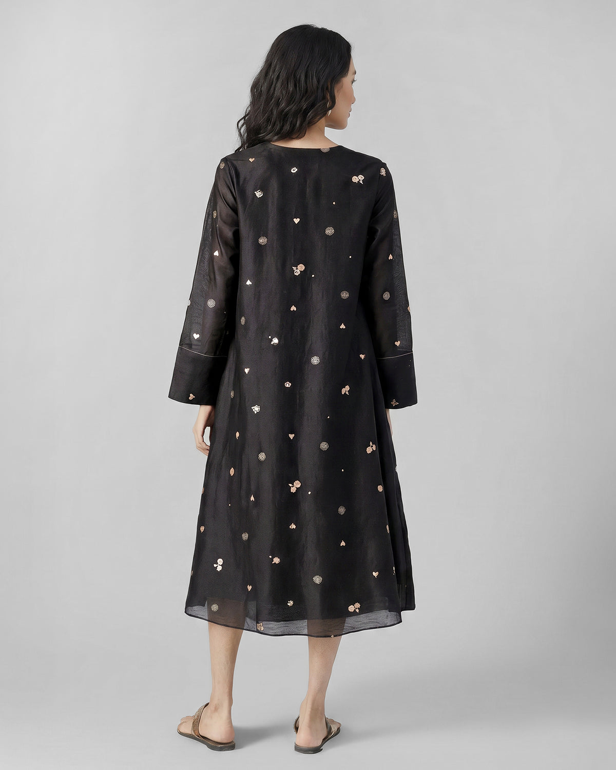 Back of a black and pink printed V-Neck Flared dress.