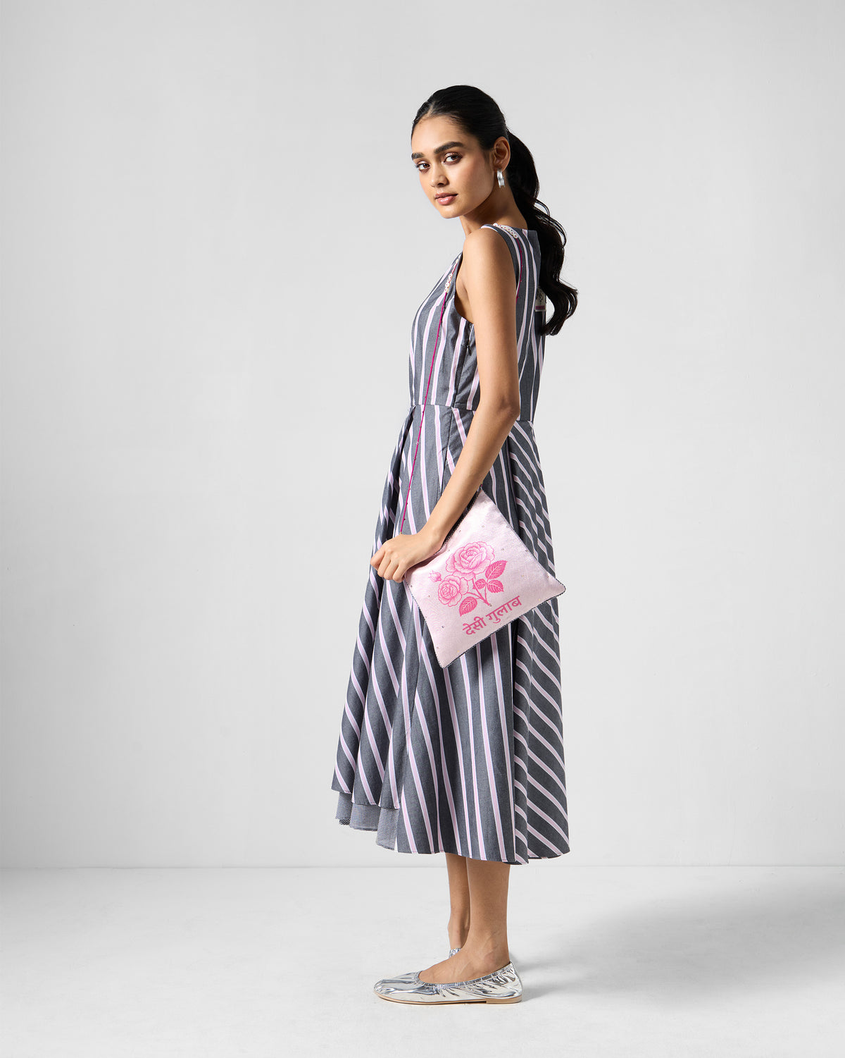 Side view of a charcoal and pink striped Tapas layered dress.