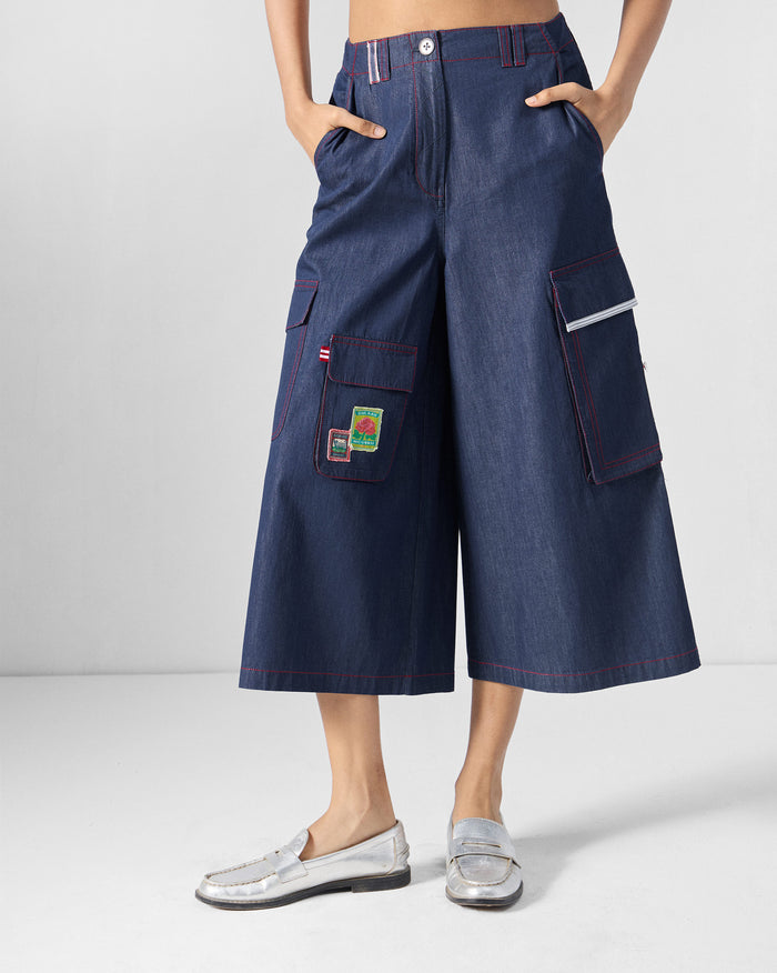 Blue Ella culottes with red contrast stitching and patched cargo pockets.