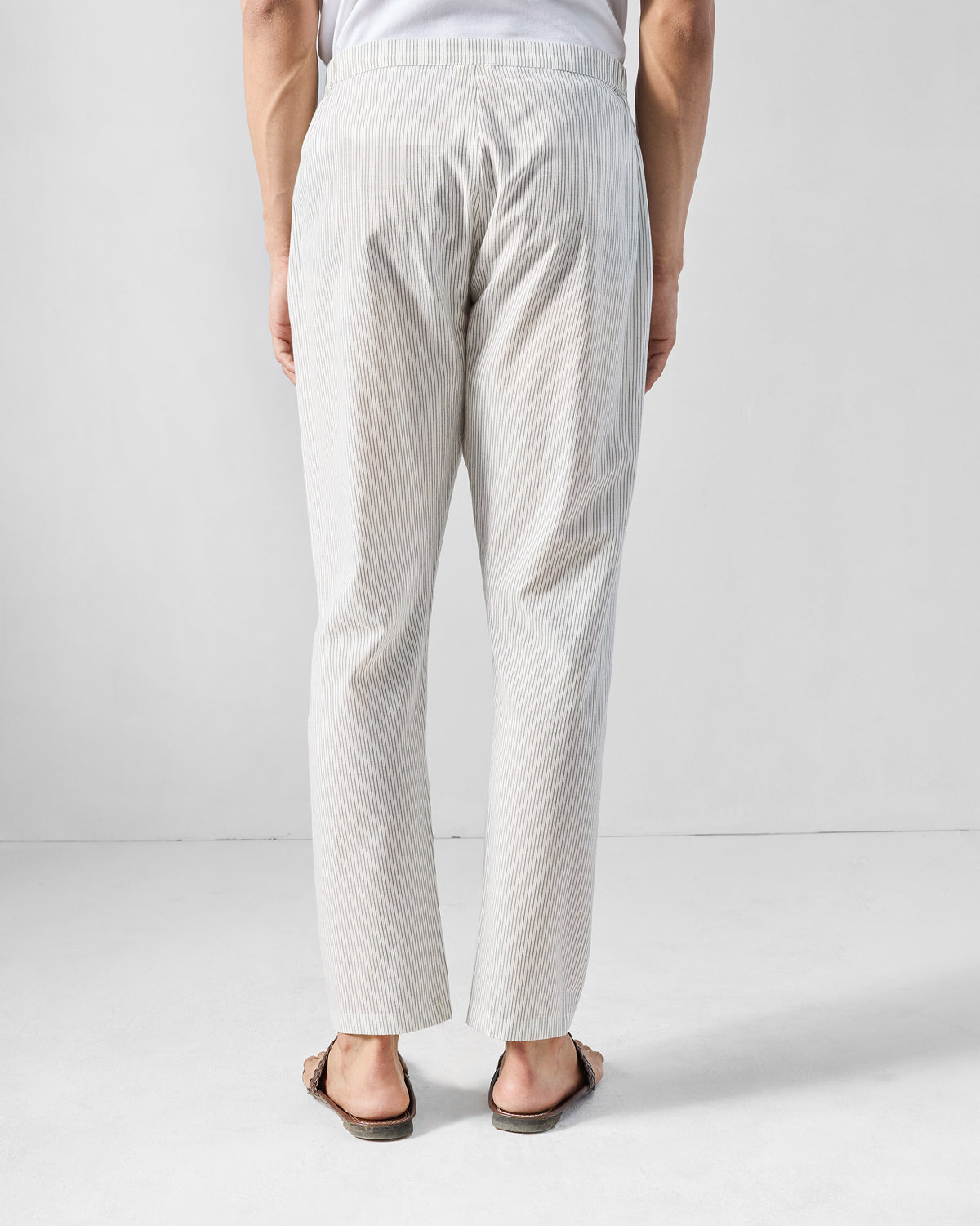 Back of charcoal and white striped Kurta Pants with an elasticated waist.