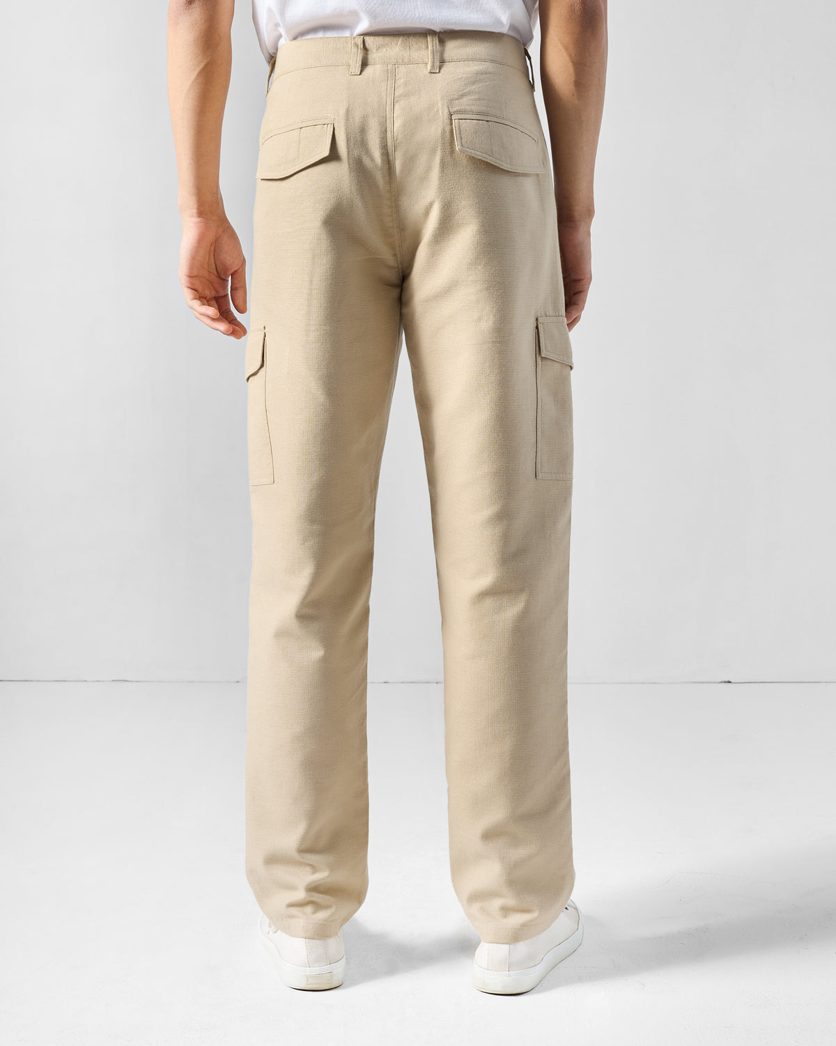 Back of natural Riverbank pants with flap pockets.