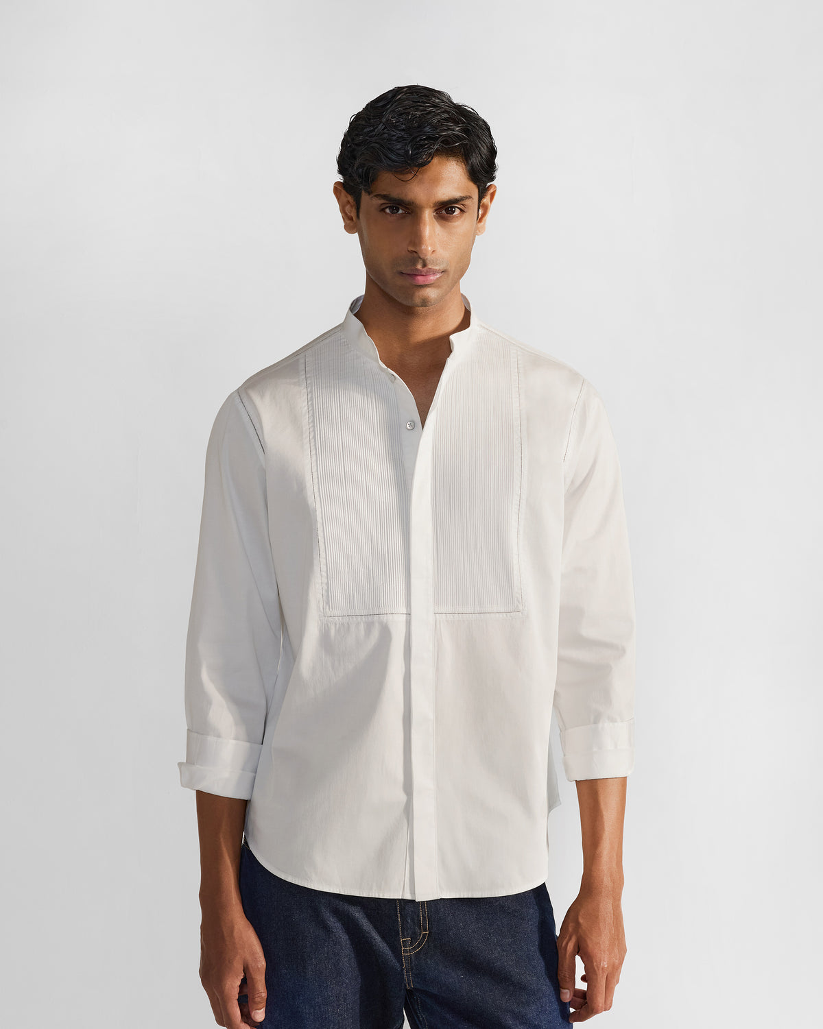 Person wearing a white Badger shirt with a pleated bib panel.