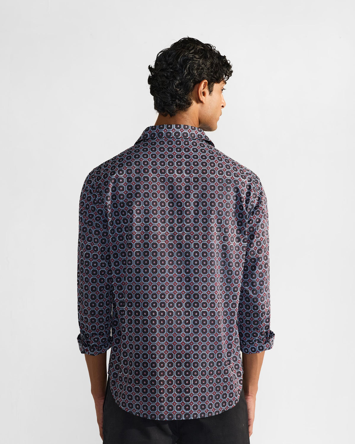 Back of a Wood Pigeon Shirt in a navy geometric block print.