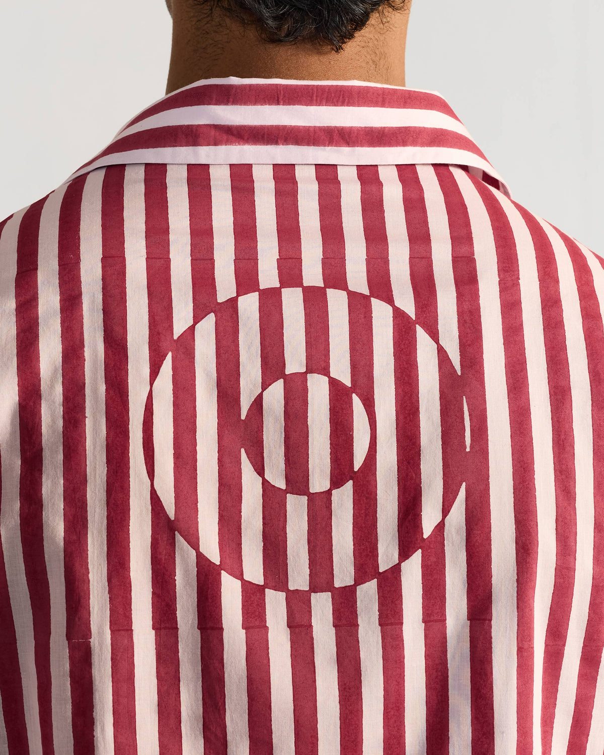 Close-up of the circular stripe motif on the back of a Civet shirt.