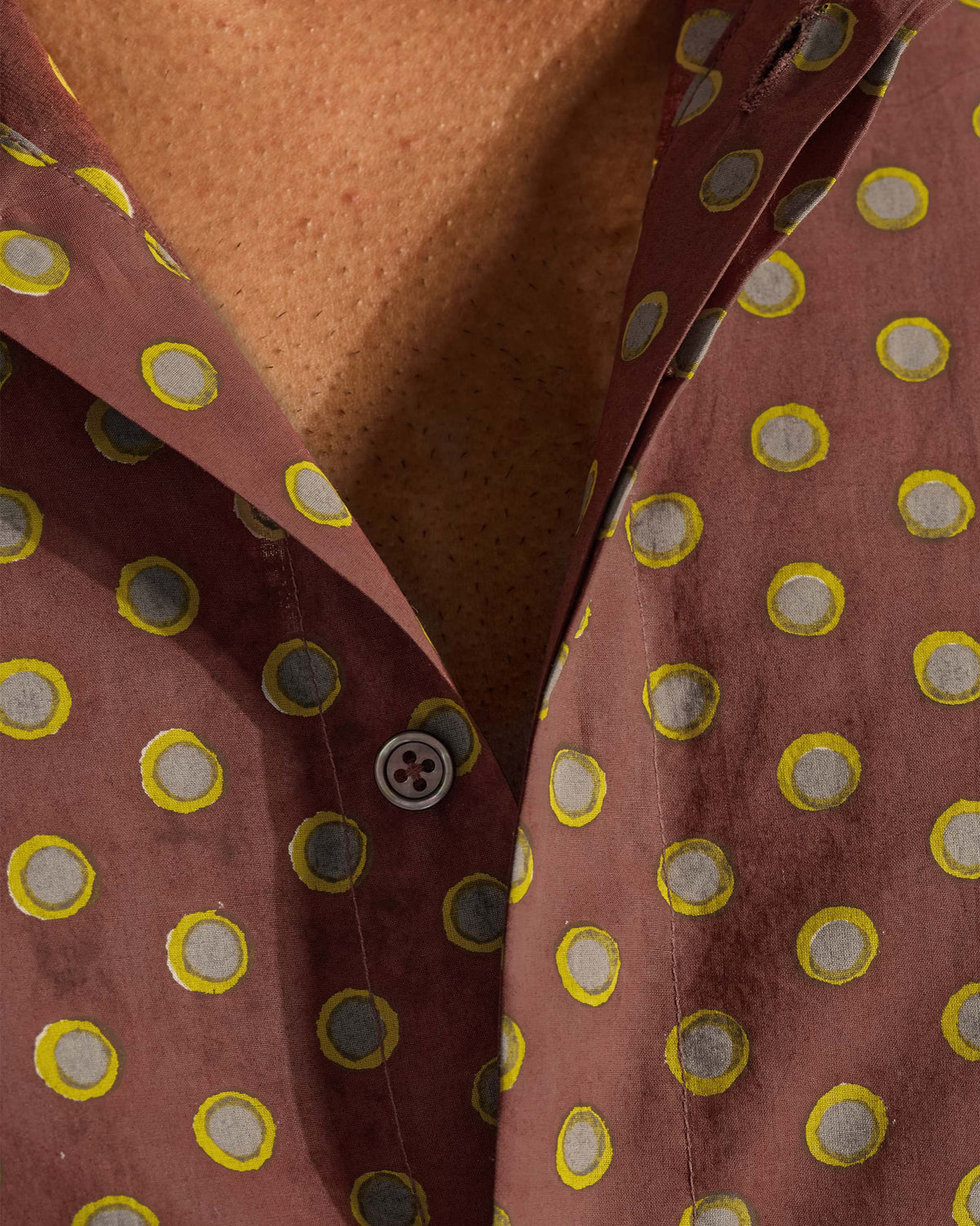 Close-up of the lime circular block print on a brown Pipit Shirt.