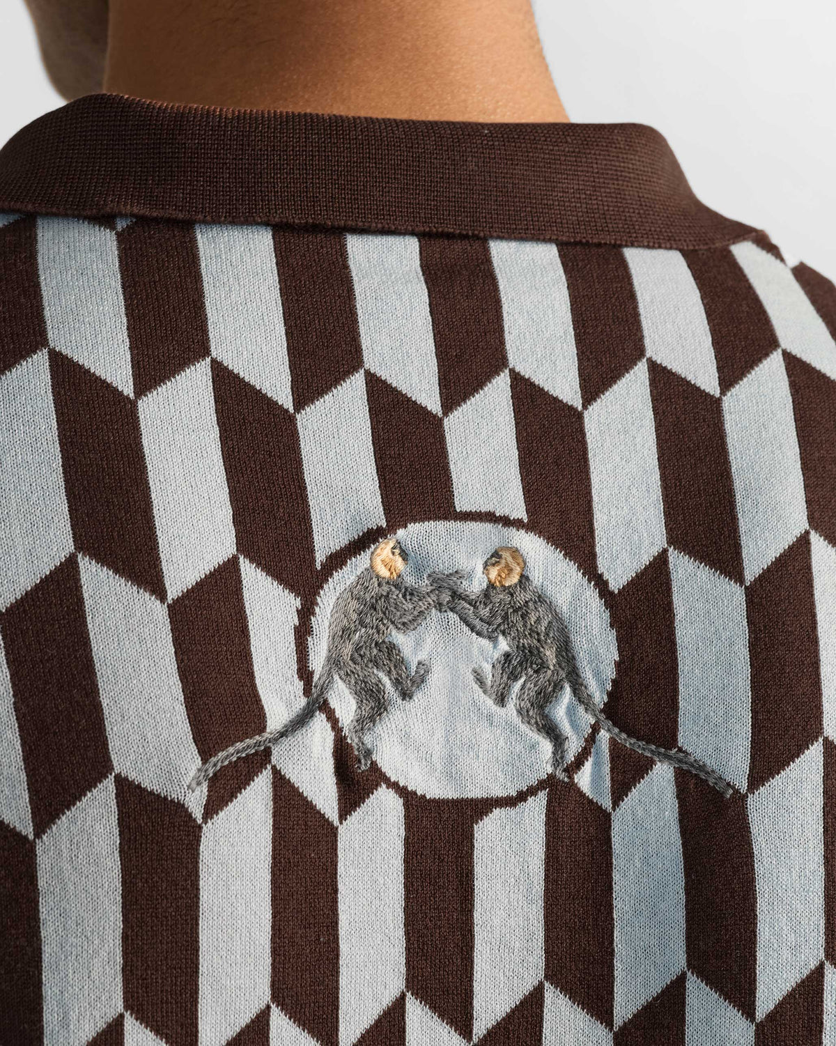 Close-up of the Langur polo back with two monkeys in a pale circle.