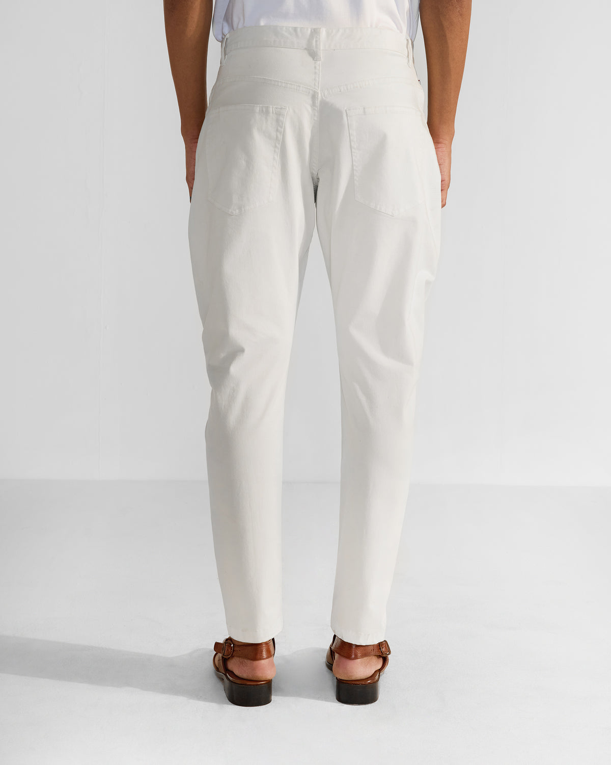 Back of off-white Serow jodhpur pants with patch pockets.
