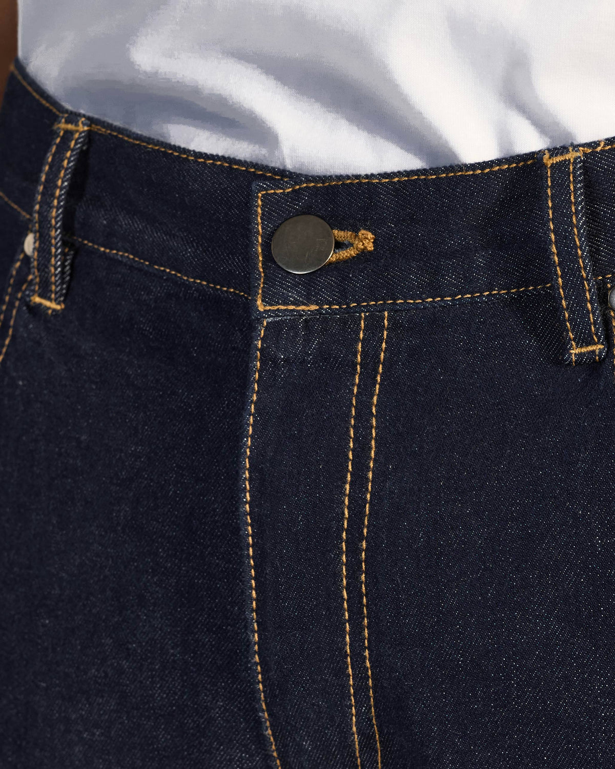 Close-up of the button waist and fly on denim Robin Jodhpur Pants.