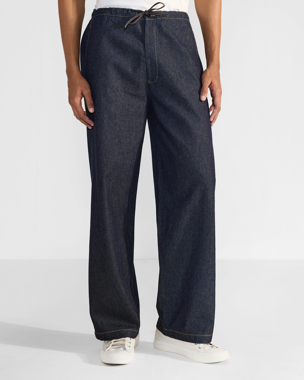 Denim Thrush Trousers with a drawstring waist and wide legs.