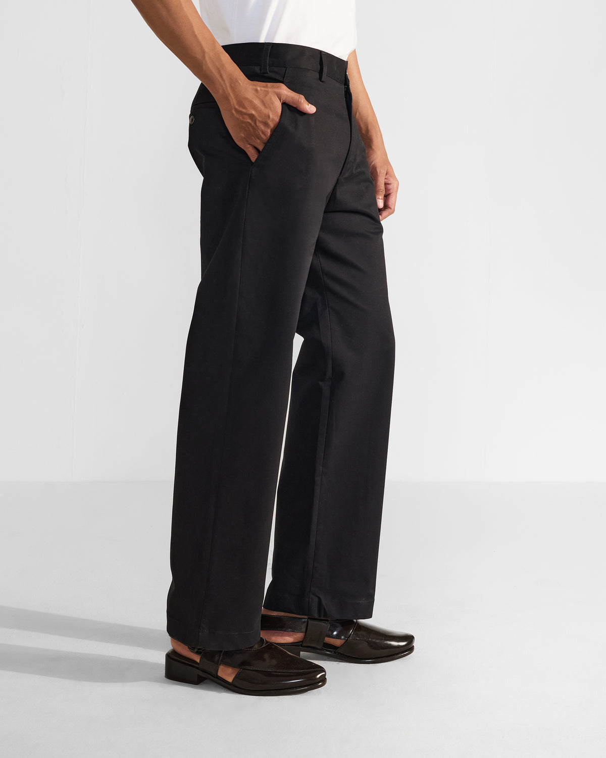 Side view of black Panther Trousers showing a straight leg and side pocket.