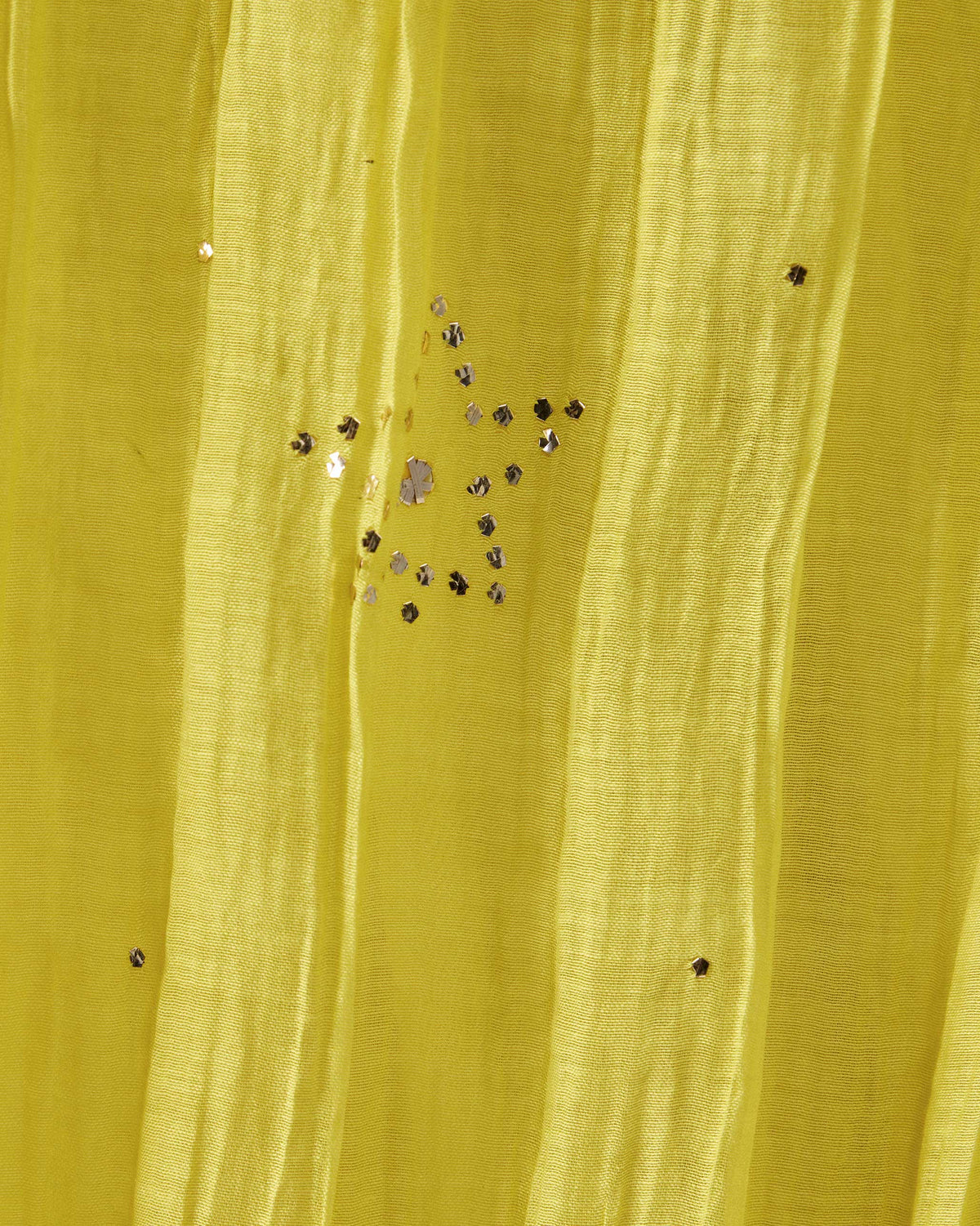 Close-up of a yellow Shanti dupatta with a silver sequin star.