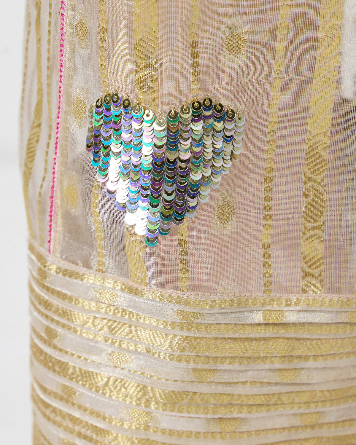 Close-up of a Ghoom Salwar showing a sequin heart motif on the sheer fabric.