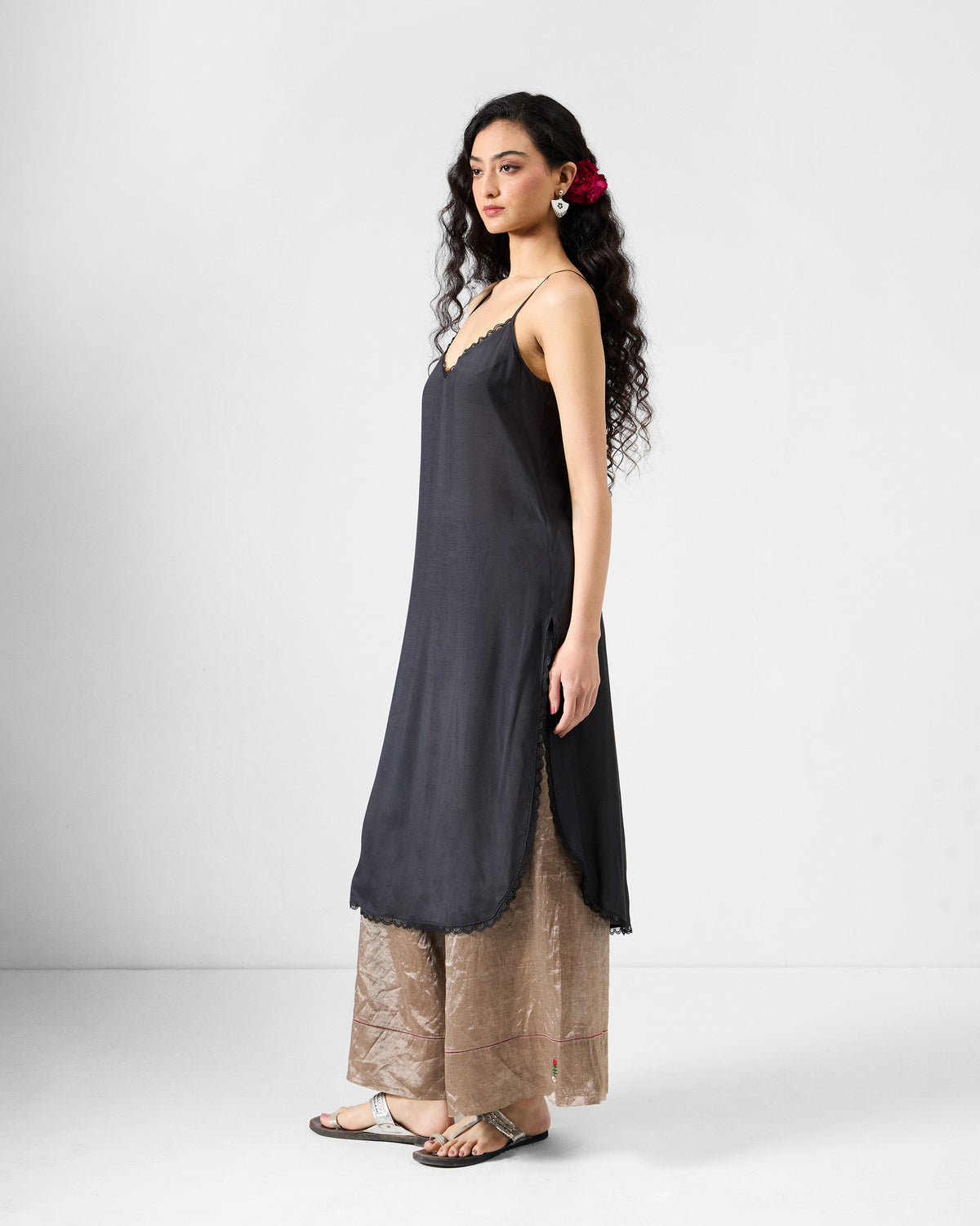 Side view of the black lace-trimmed slip for the Amboli Kaftan.