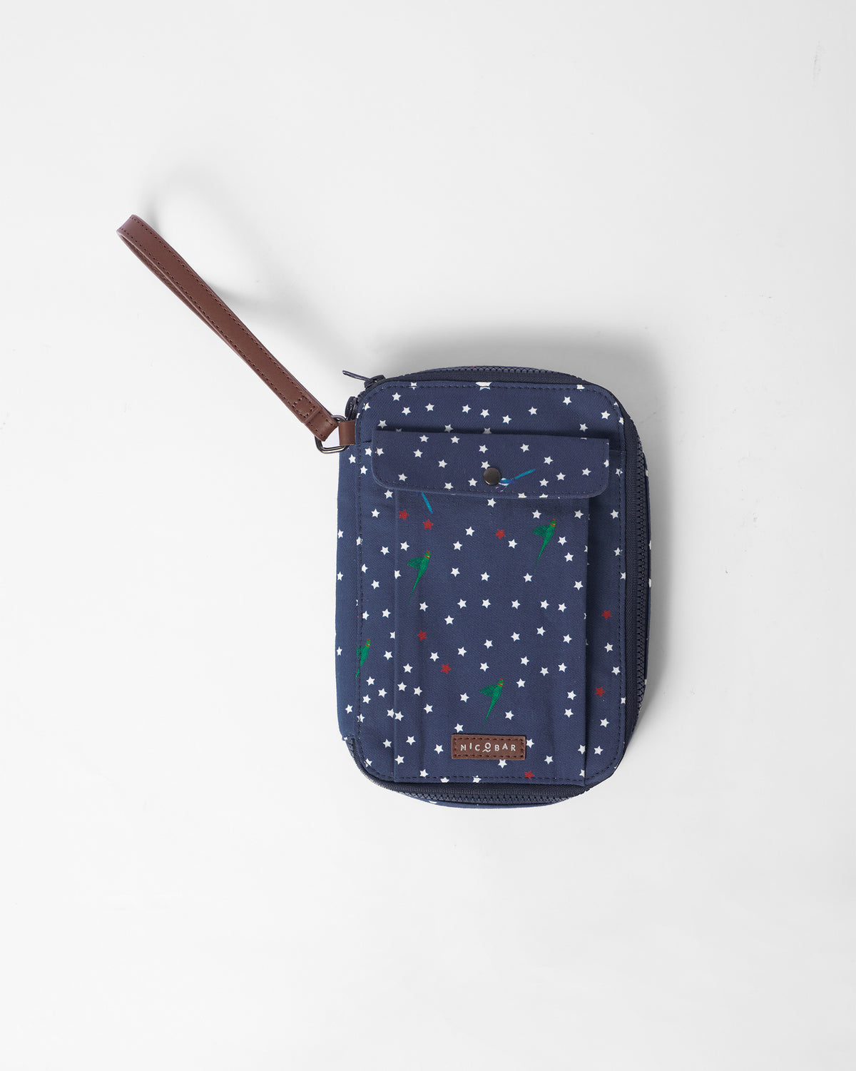 Navy Gadget Pouch with a star and parrot print and a brown wrist strap.