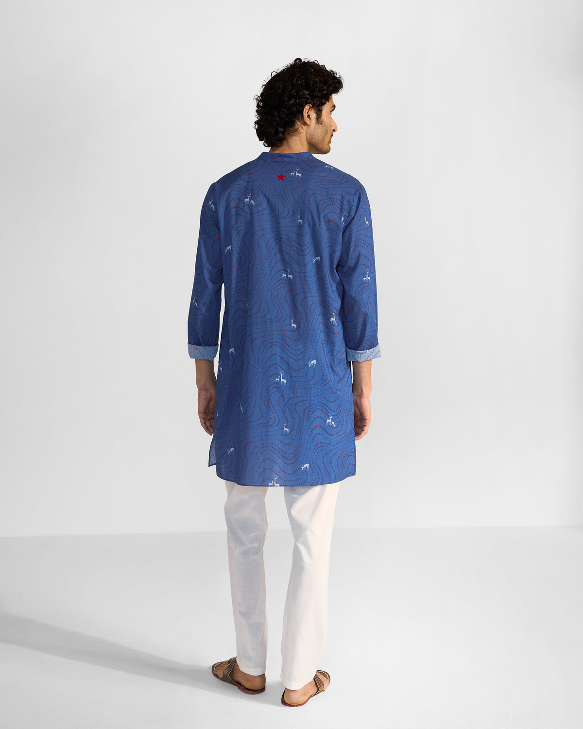 Back of a blue Front Pleat kurta with deer print and a red yoke detail.