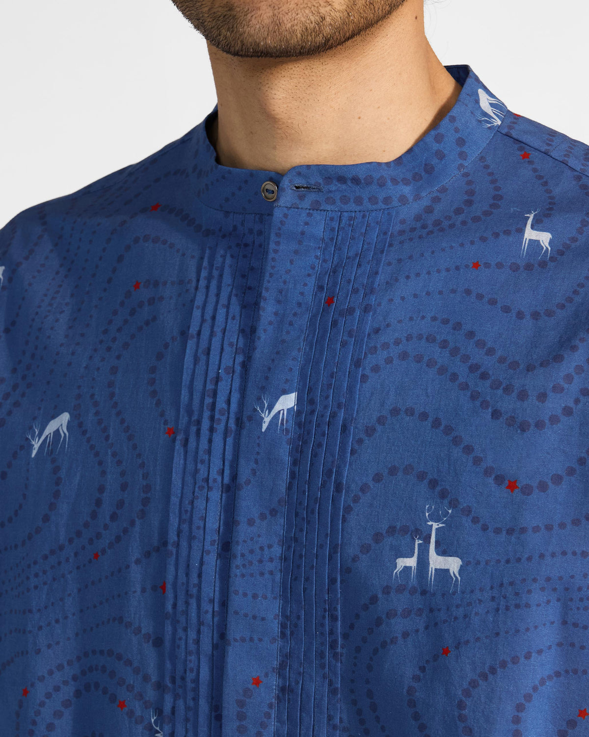 Close-up of front pleats and deer print on a blue Front Pleat kurta.