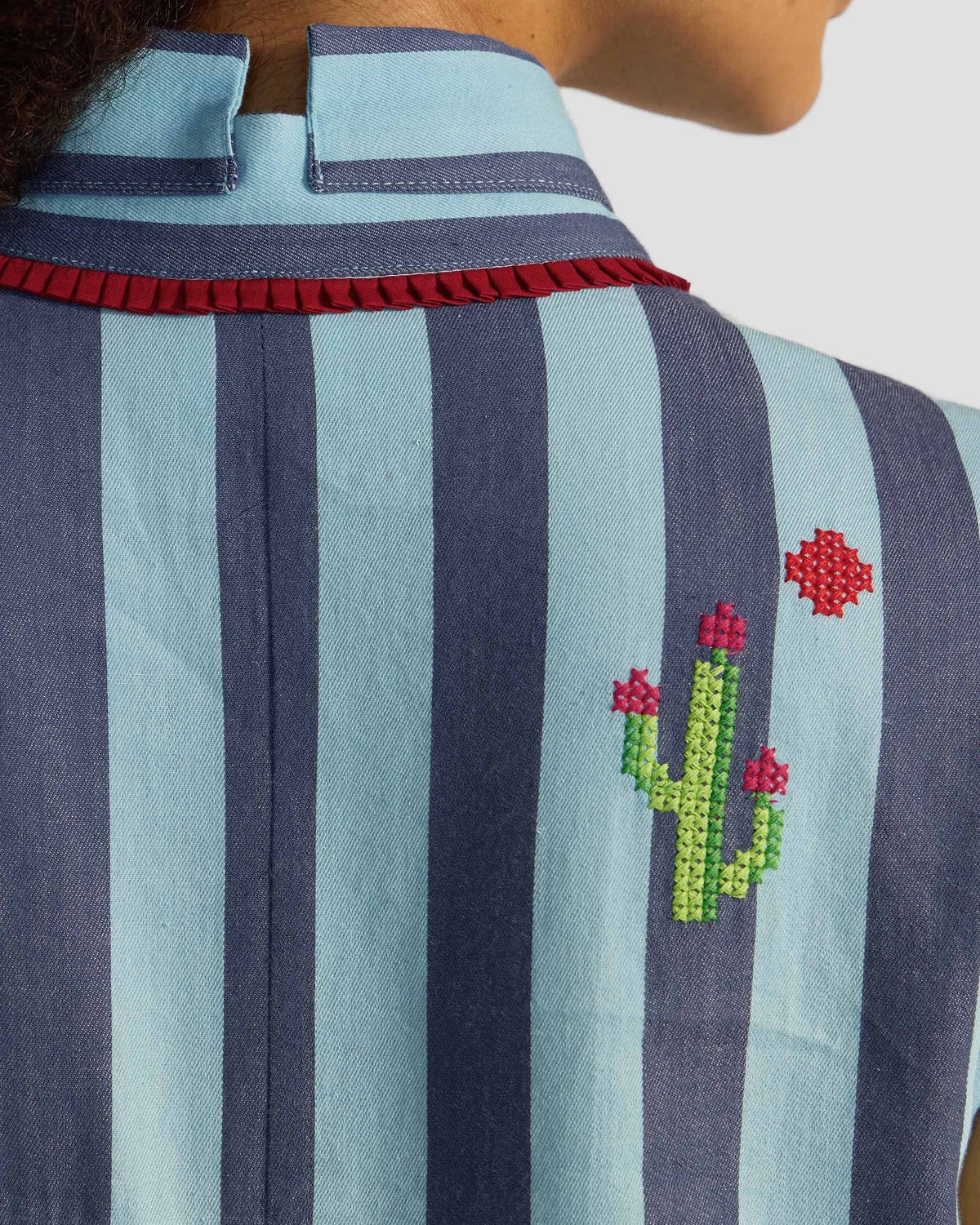 Close-up of a cactus embroidery on the back of a Bargi jumpsuit.