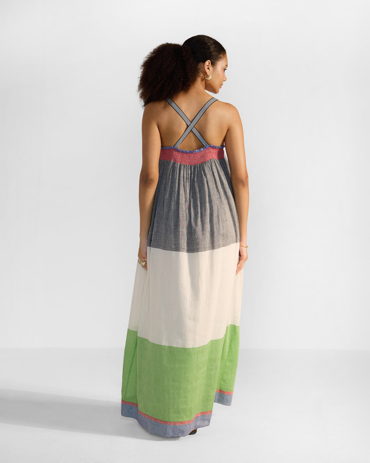 Back of a multicolour Bina maxi dress with crossed striped straps.