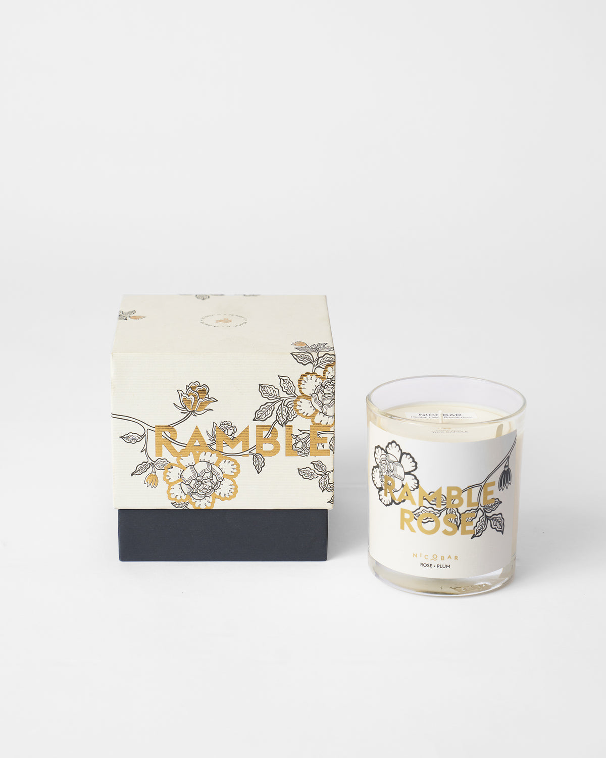 Ramblerose Candle shown beside its gift box.