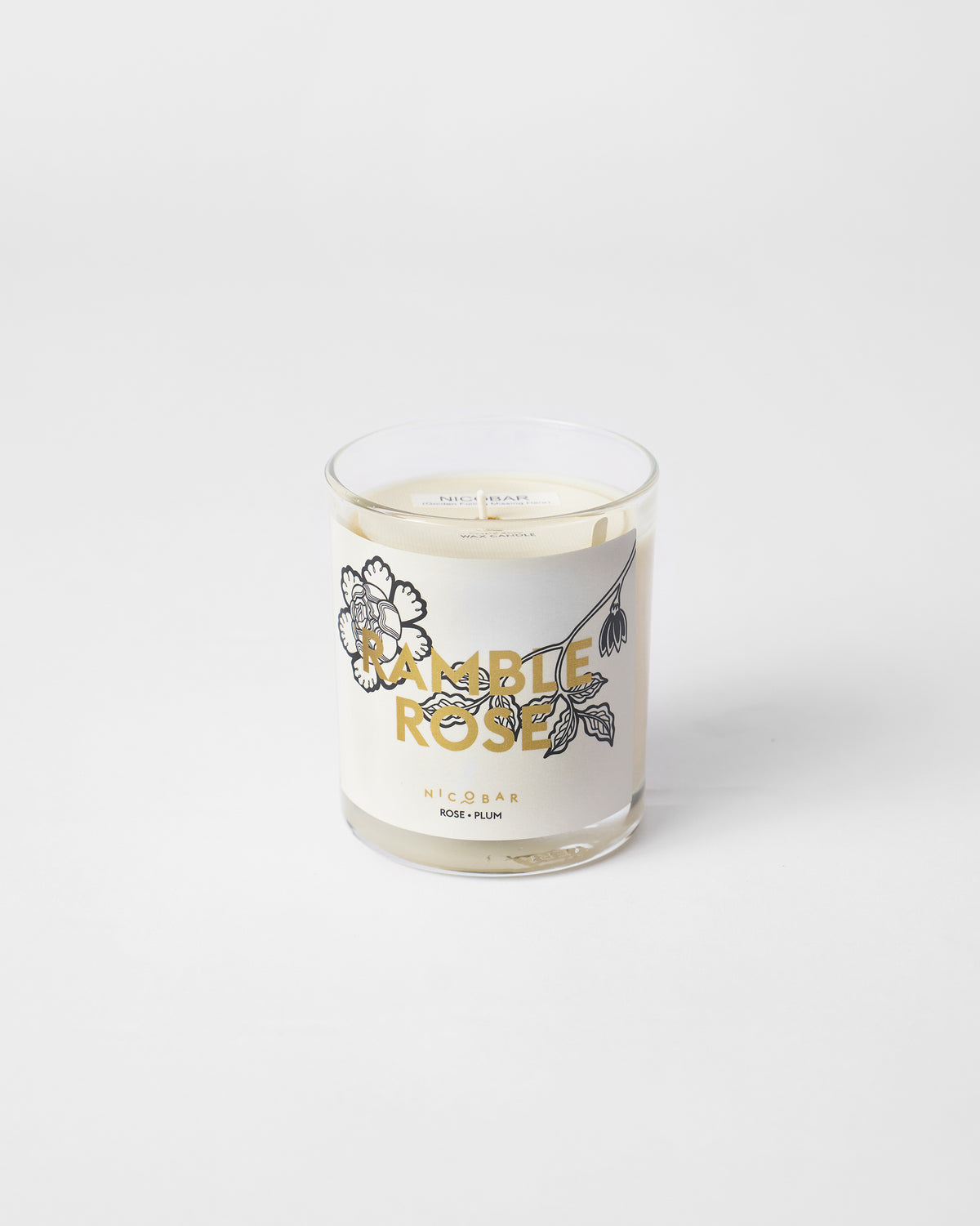 Unlit Ramblerose Candle in a clear glass.