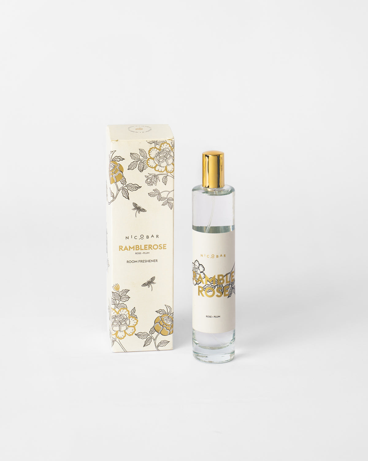 Ramblerose room spray bottle with its box on a white surface.