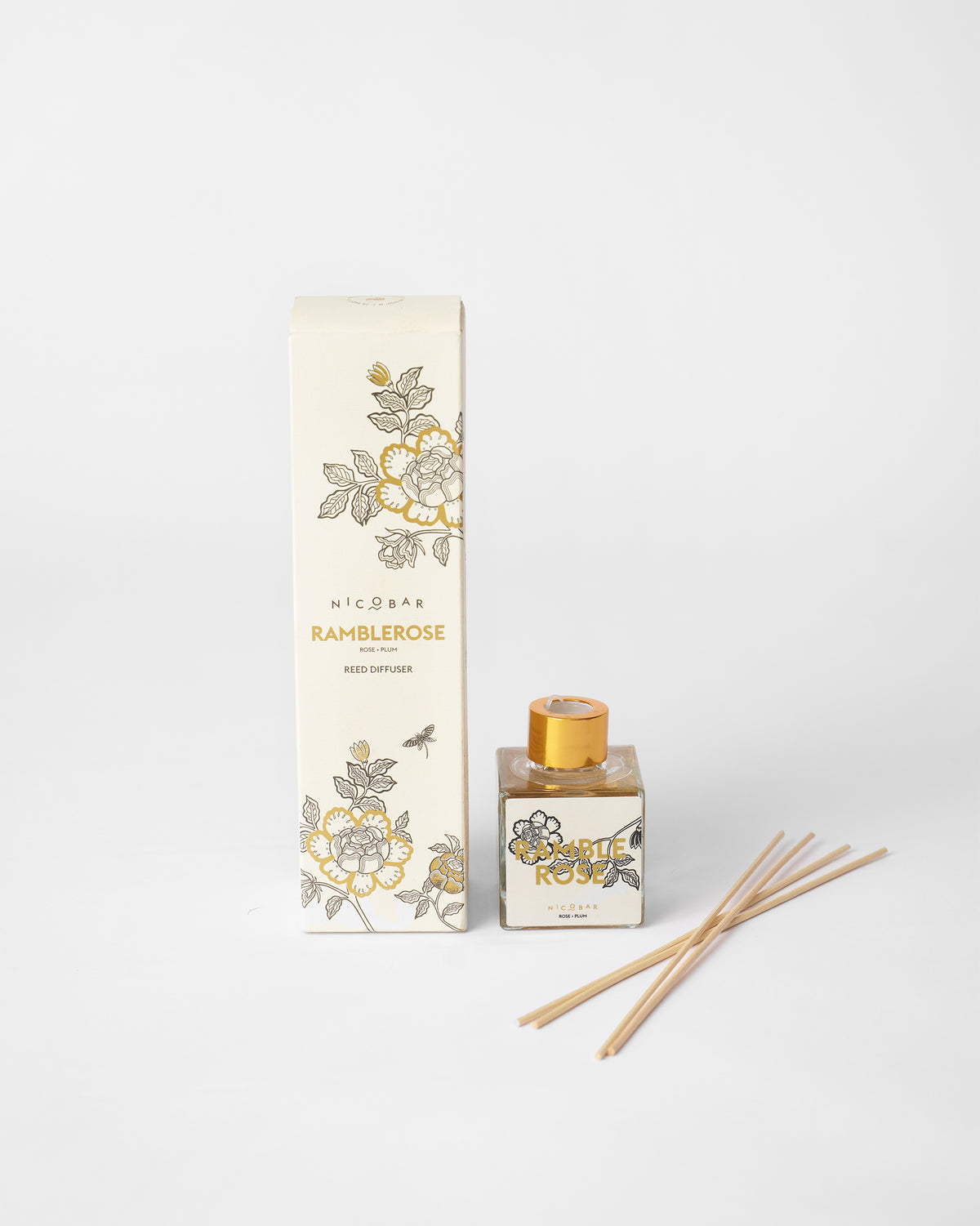 Ramblerose reed diffuser beside its printed box.