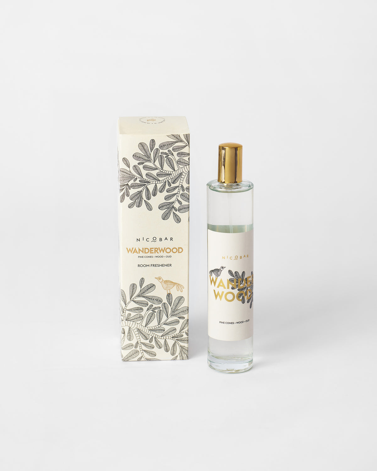 Wanderwood Room Spray bottle beside its leaf-pattern box.