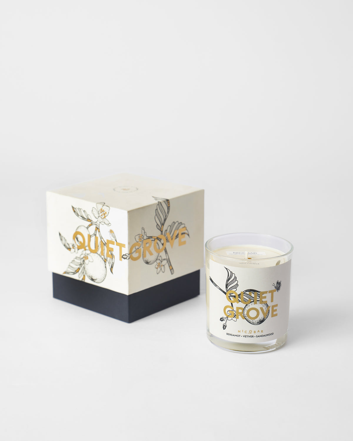 Quiet Grove Candle shown beside its gift box.