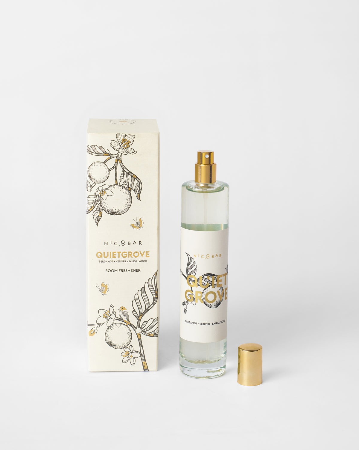 Quiet Grove Room Spray beside its cream box, with the cap off.
