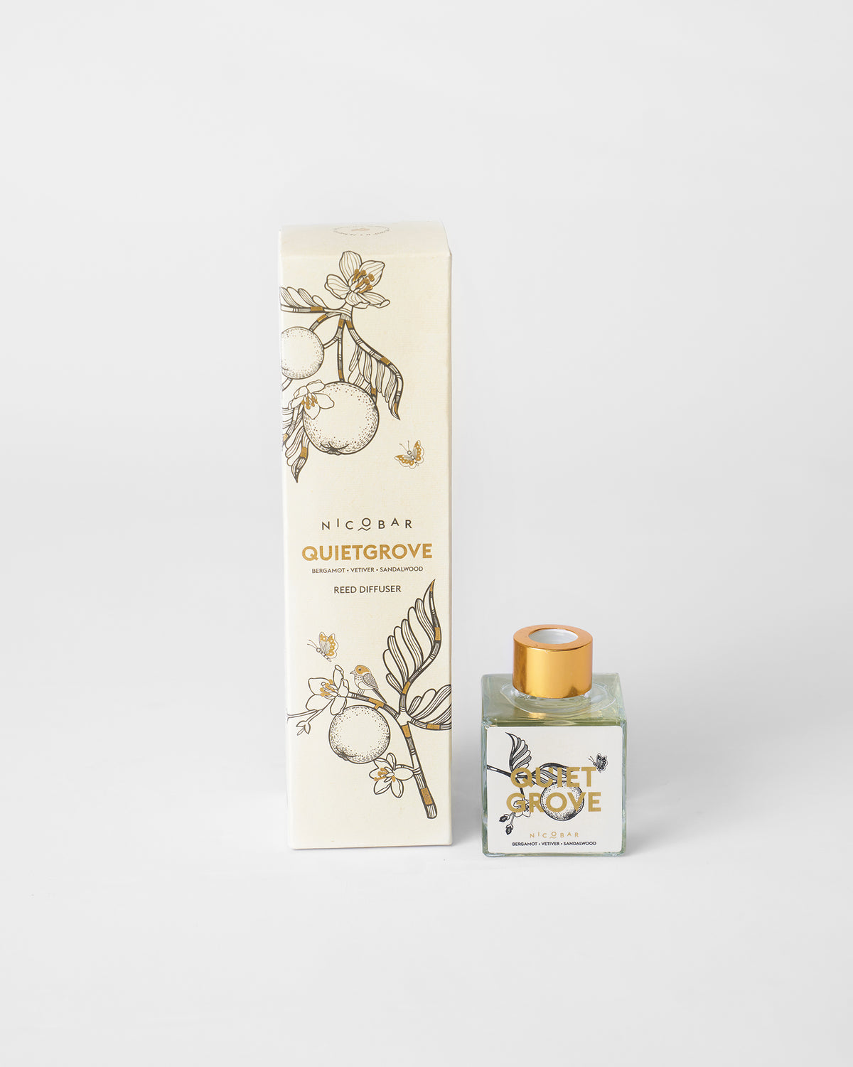 Quiet Grove reed diffuser bottle beside its illustrated cream carton.
