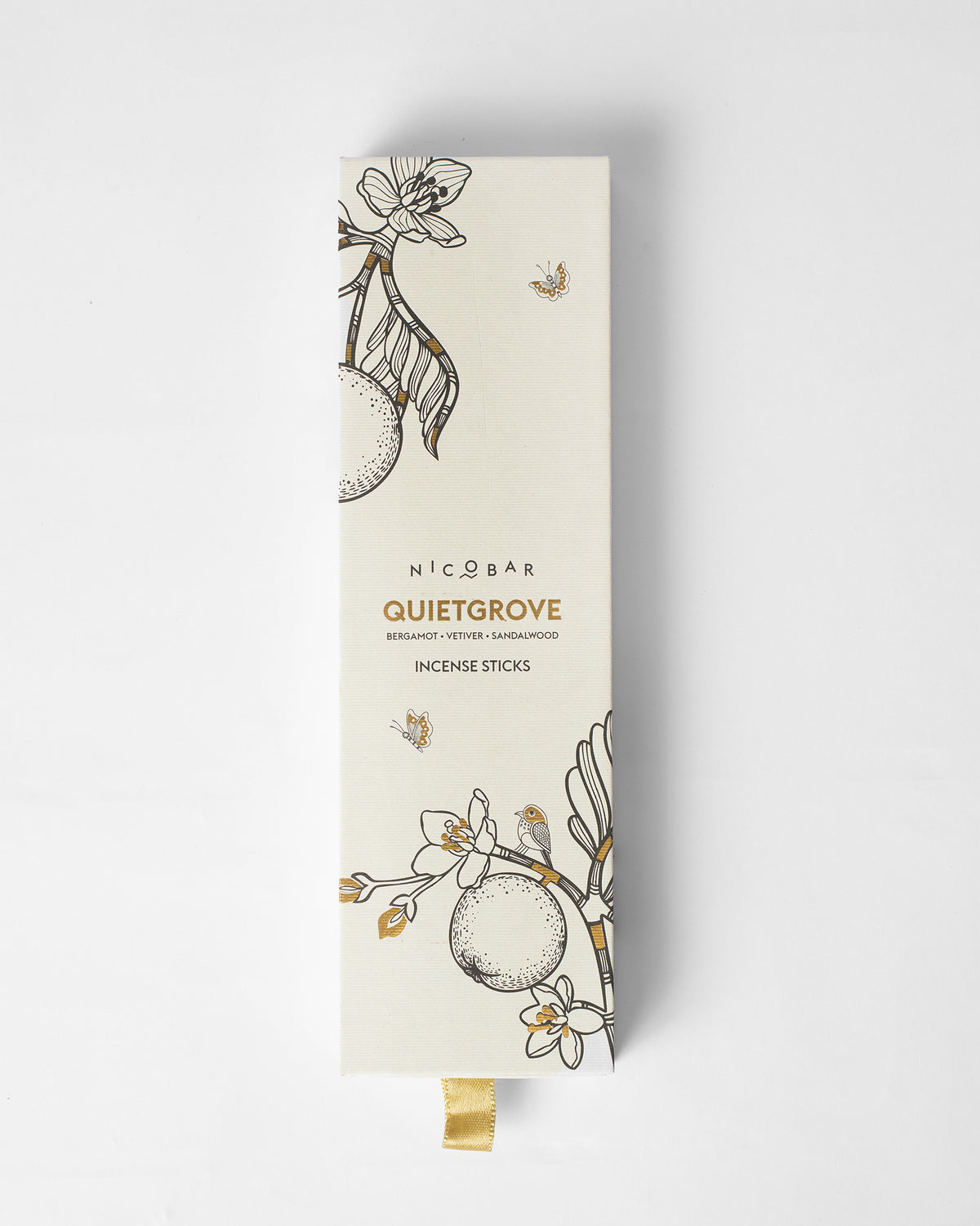 Quiet Grove Incense Sticks box with a cream botanical design and gold ribbon.