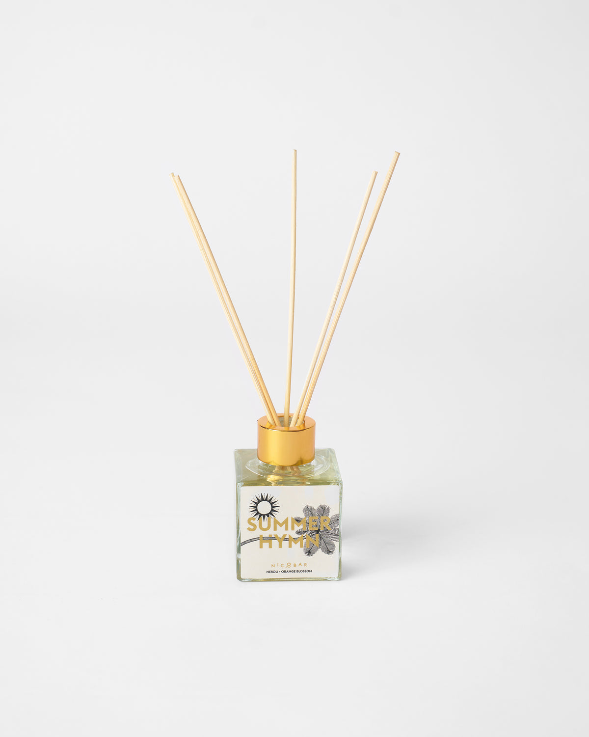 Summer Hymn reed diffuser bottle with gold cap and five upright reeds.