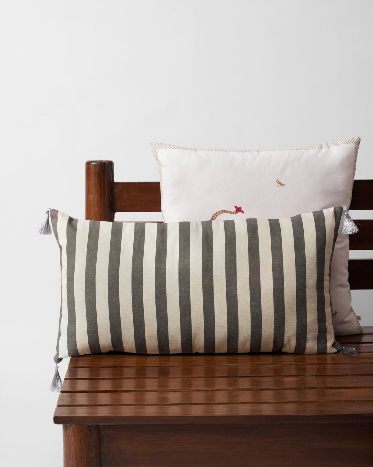 Blooming Fern cushion cover with black and cream vertical stripes.