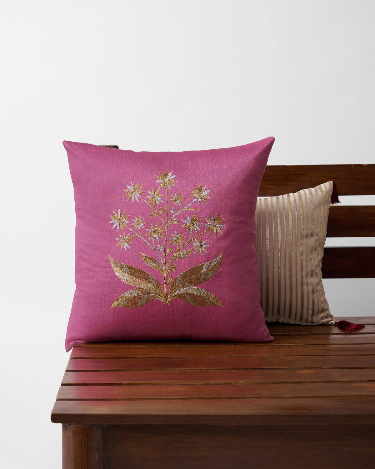 Mogra cushion cover in pink with gold and silver embroidered flowers.