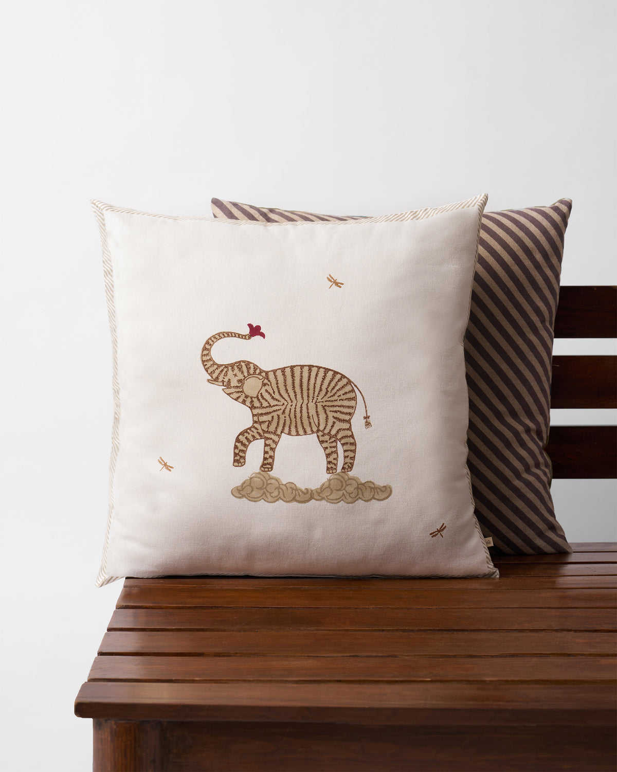 Marching Ele Cushion Cover with an elephant motif standing on clouds.