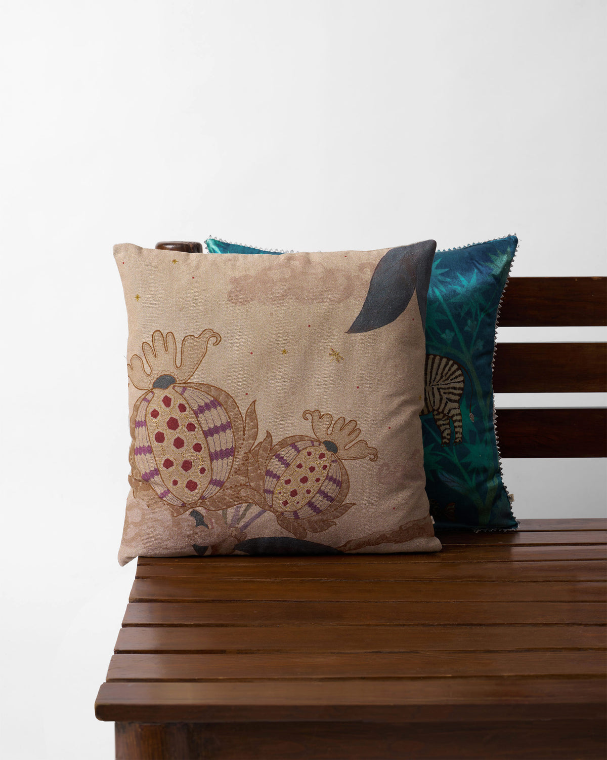 Pomme Cushion Cover in beige with striped fruit motifs in red and purple.