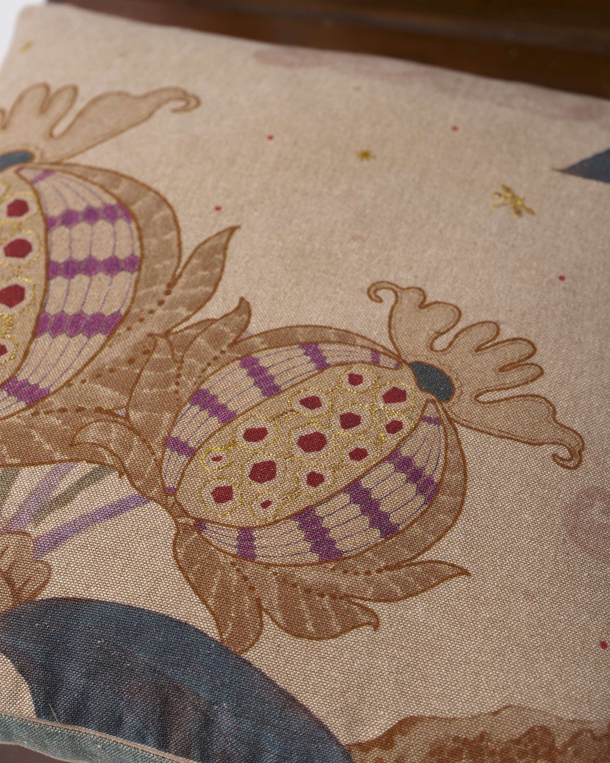 Close-up of the Pomme Cushion Cover showing striped fruit motifs with red dots.