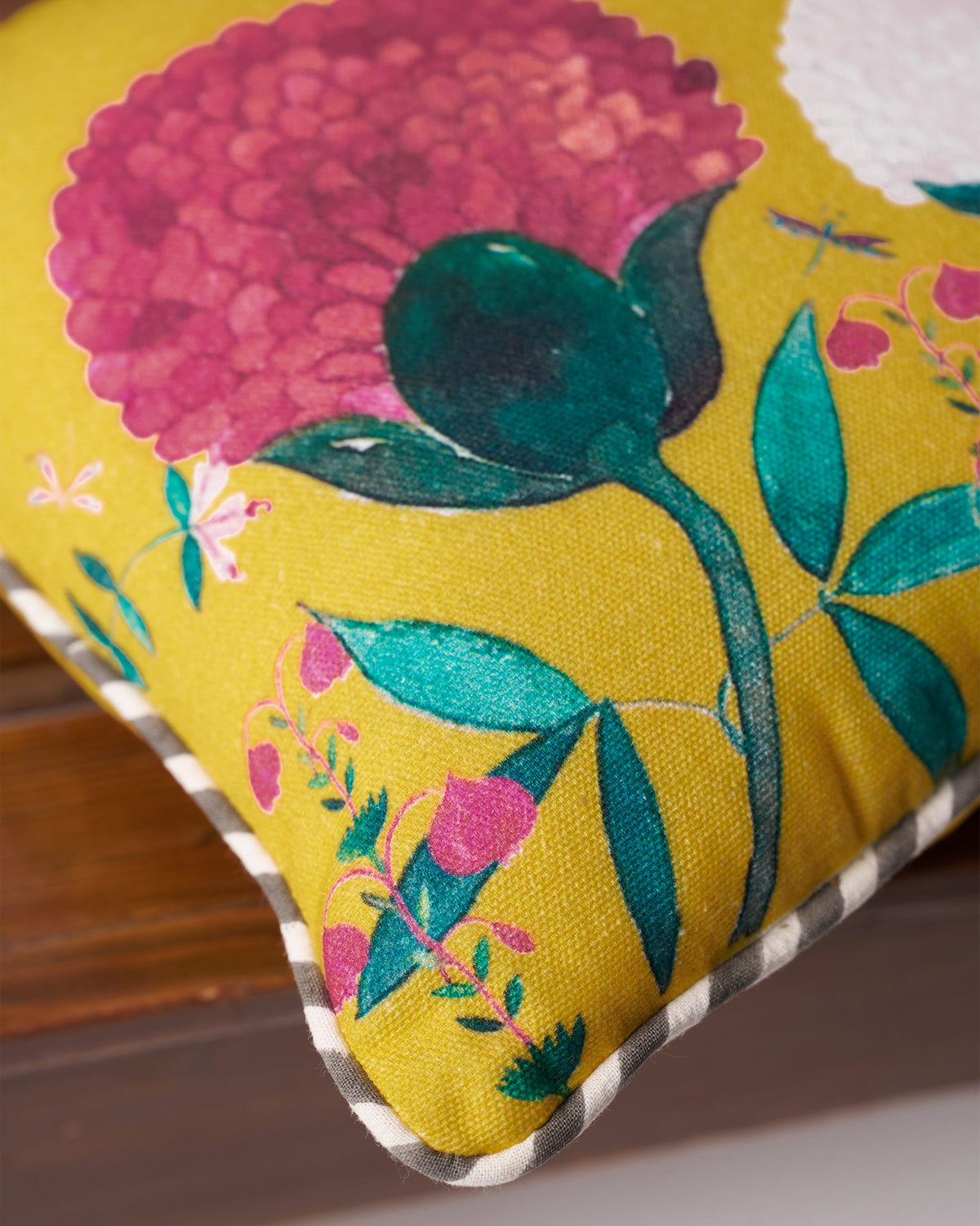 Close-up of a Winter Wonderland Car Cushion showing pink flower and leaf print.
