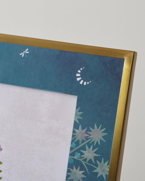 Close view of the teal border with a moon and stars