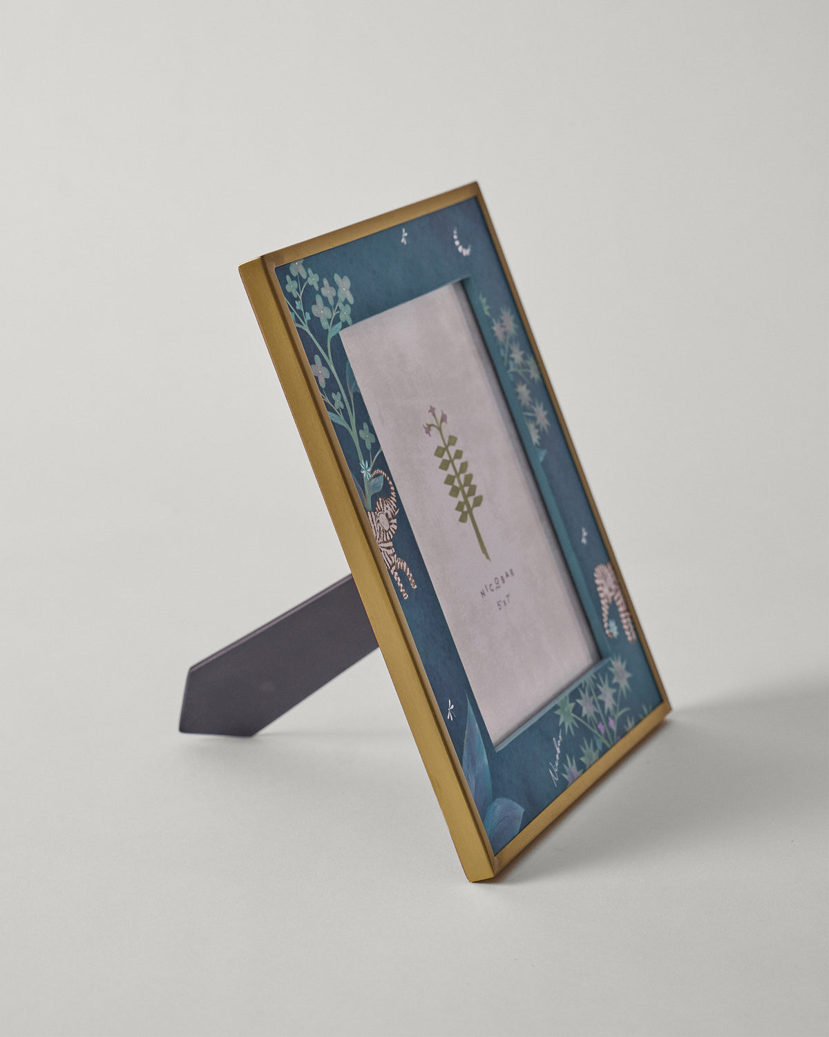Side view of Midnight Tusk frame on its easel stand.